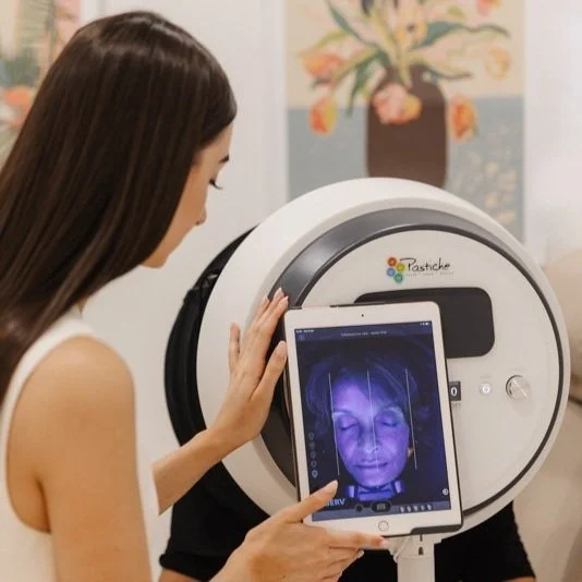 Patient receiving skin analysis before a dermal filler treatment in Brisbane skin clinic