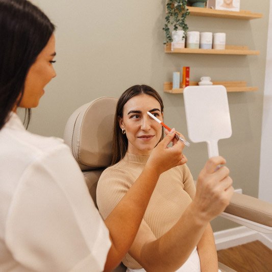 Patient having a injectables consultation for a lip filler treatment in Brisbane clinic