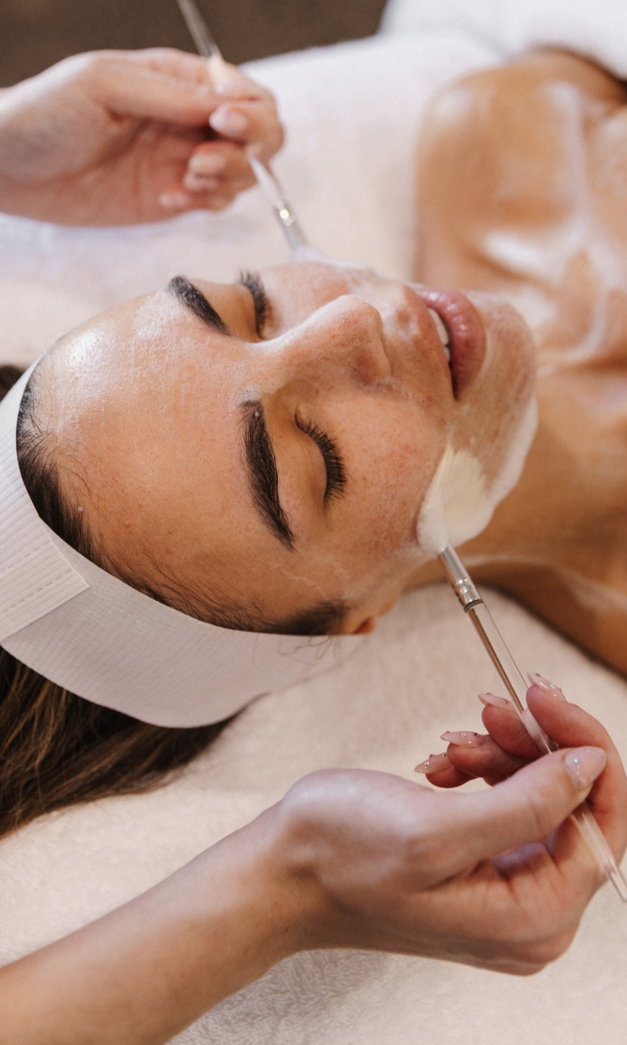 a women receiving a facial treatment