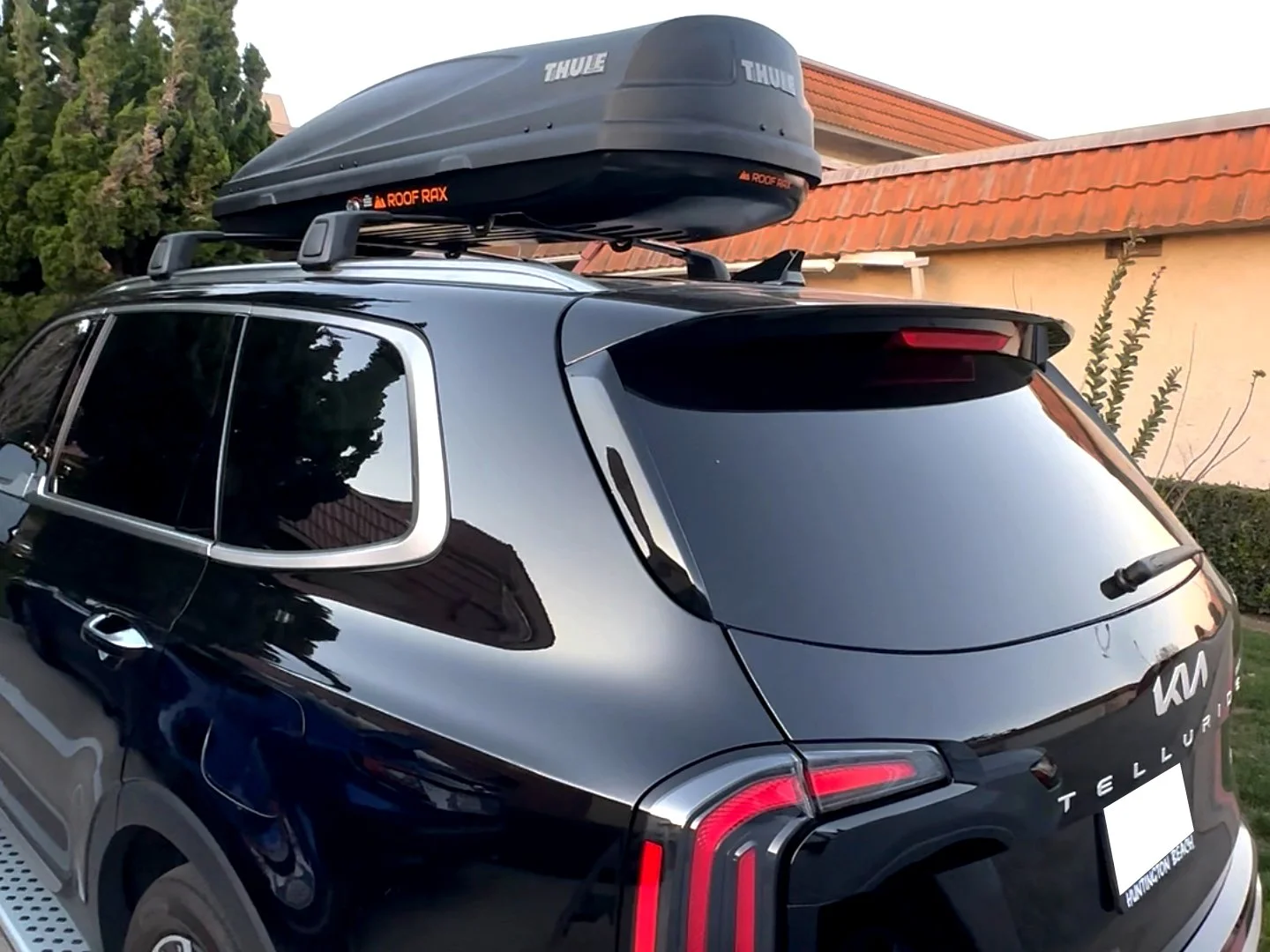 Kia Telluride with Thule roof cargo box installed by Roof Rax