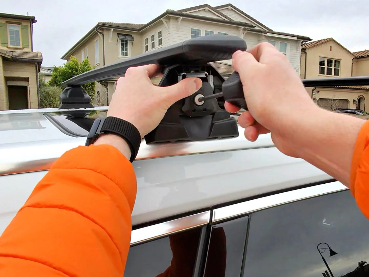 Roof cargo box installation on vehicle crossbars by Roof Rax