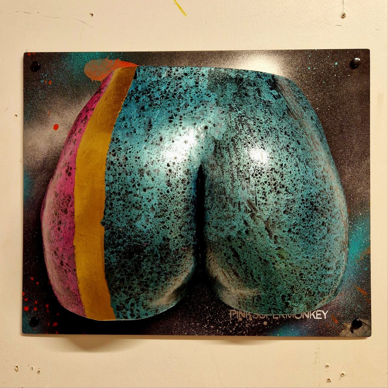 Graffiti art of a peach with a sliced side revealing pink, yellow, and blue colors, with a black background and speckled texture.