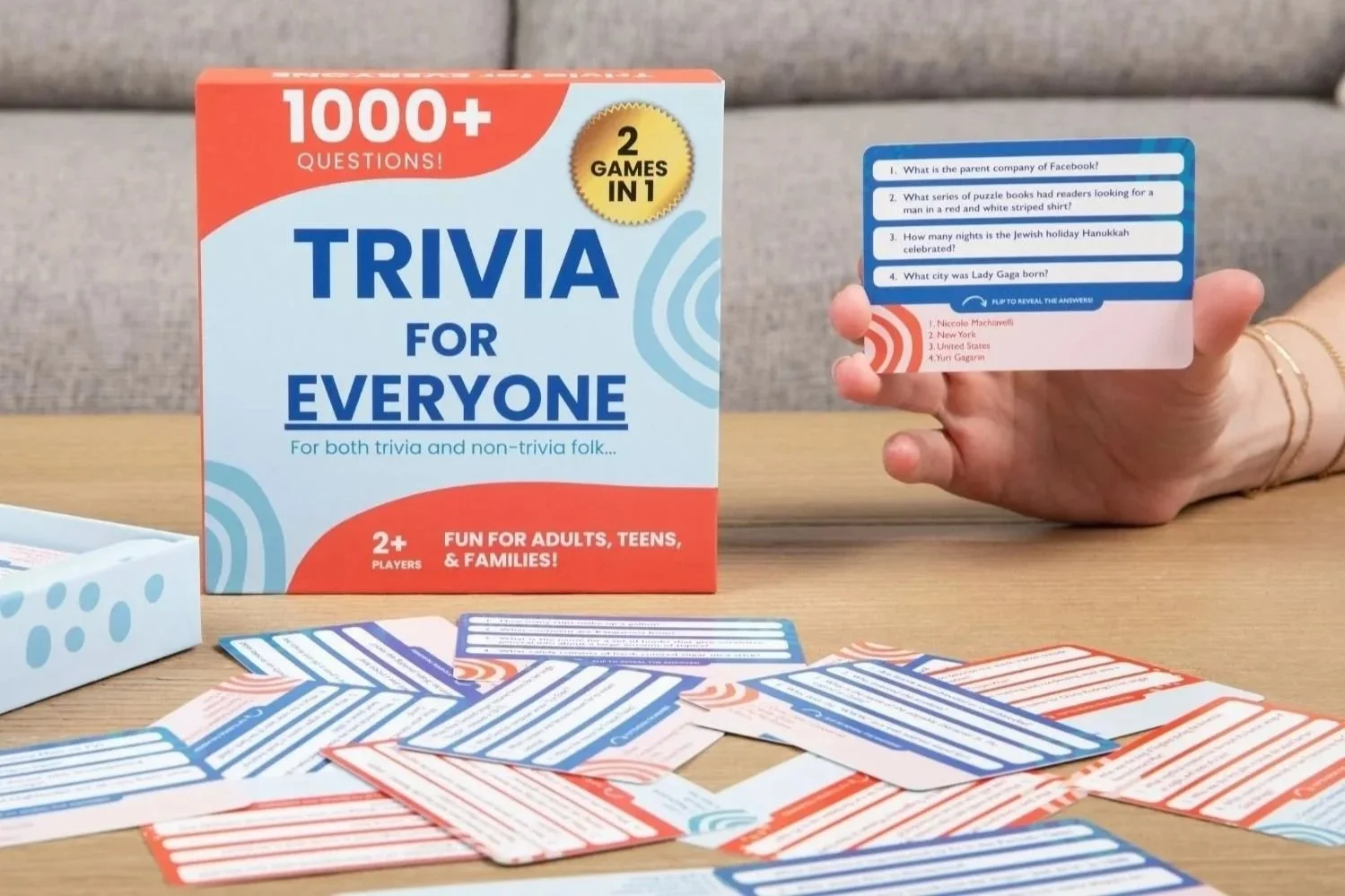 Trivia for Everyone game box with cards on a coffee table