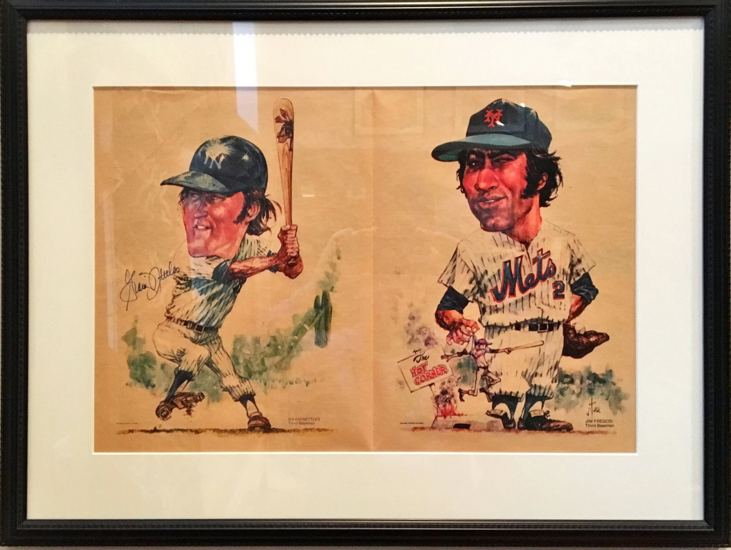 Vintage baseball illustration of two players from the New York Mets team, signed by Jim Fregosi, framed and displayed on a wall.