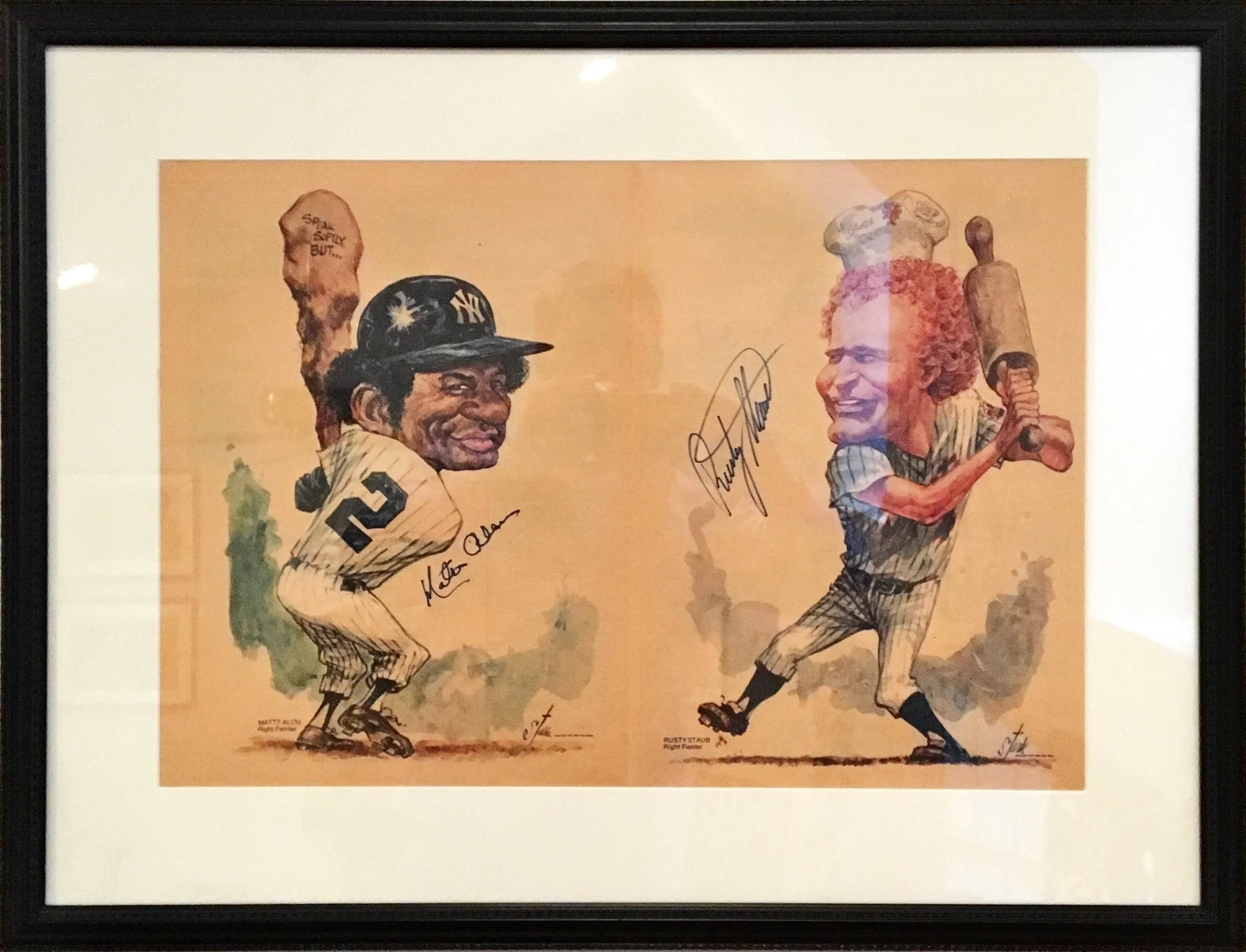 A framed illustration of two baseball players in vintage uniforms, one holding a bat and the other with hands on hips, with signatures and labels underneath.