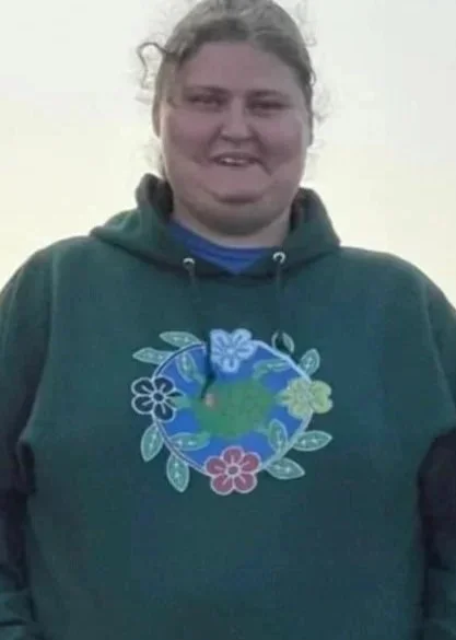 Hayley Poitra Wearing TM Mikinaak Ode Center merchandise.