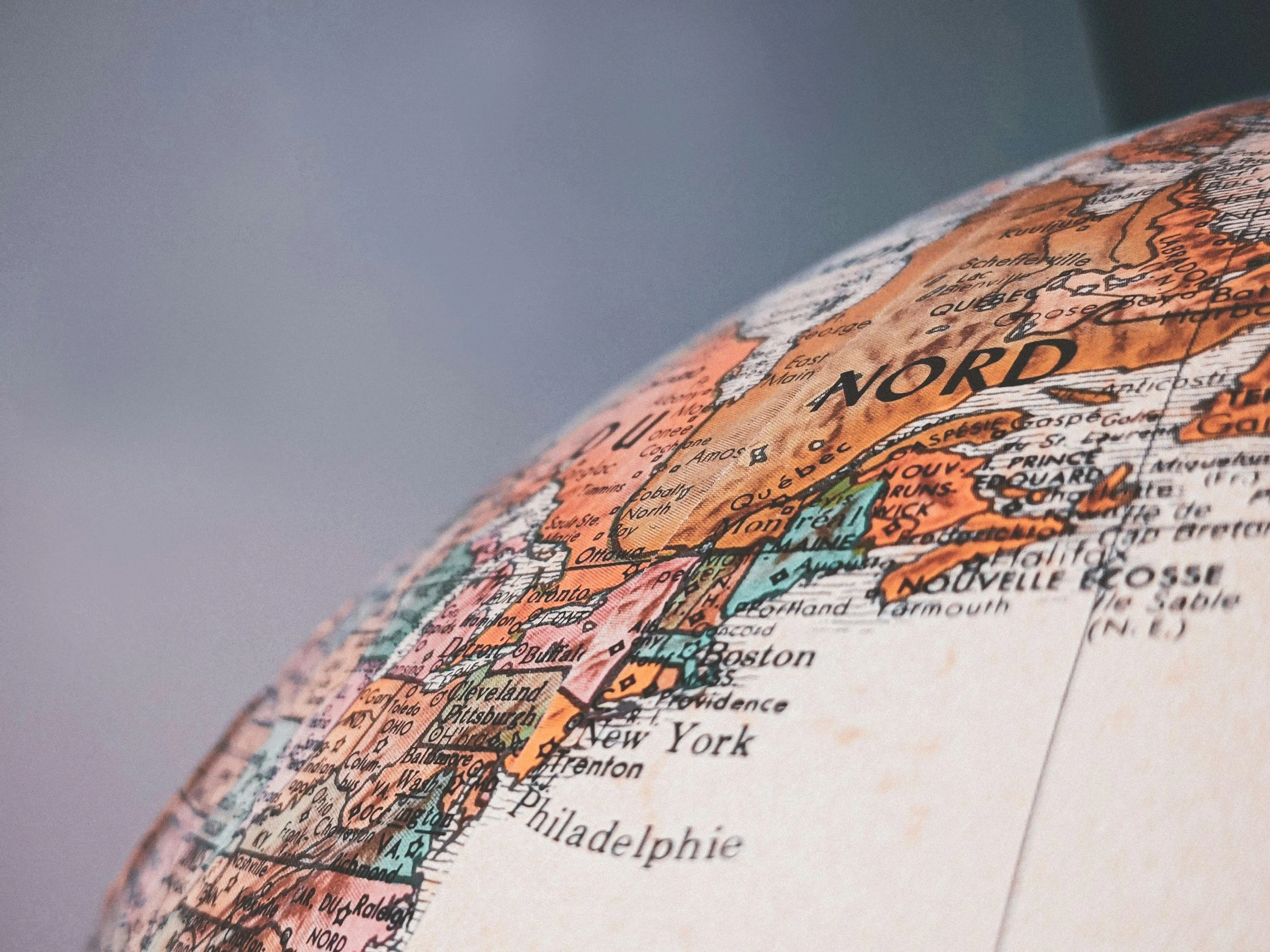 Close-up of a globe showing North America, with parts of Canada, USA, and Mexico visible.