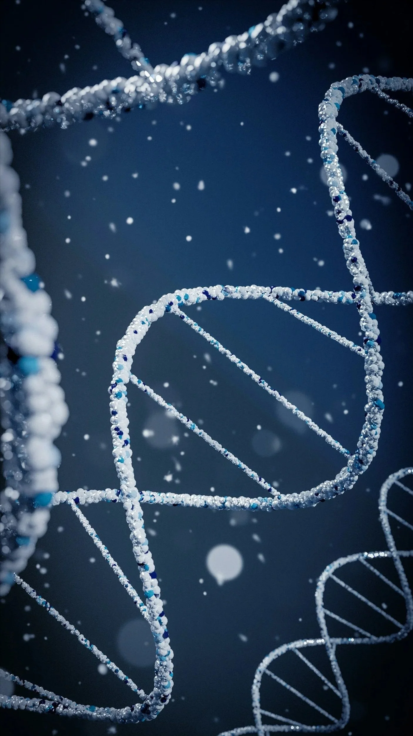 Close-up of suspended DNA double helix structures with water droplets against a dark background.