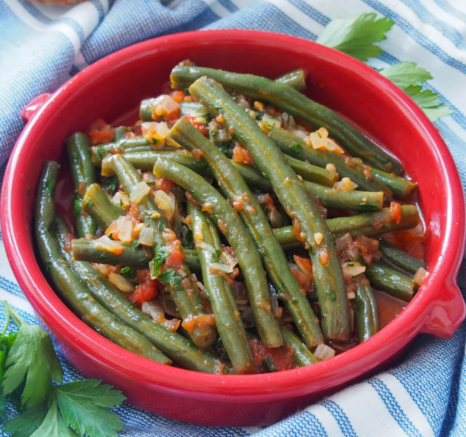 Fasolakia - Green beans slow-simmered in a savory tomato sauce with traditional Greek spices. (GF, V)