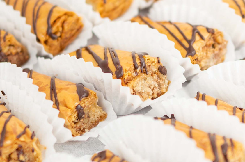 Flogeres - Flogeres are delicate, crispy phyllo pastry rolls filled with sweetened ground walnuts and then drizzled with a decadent chocolate