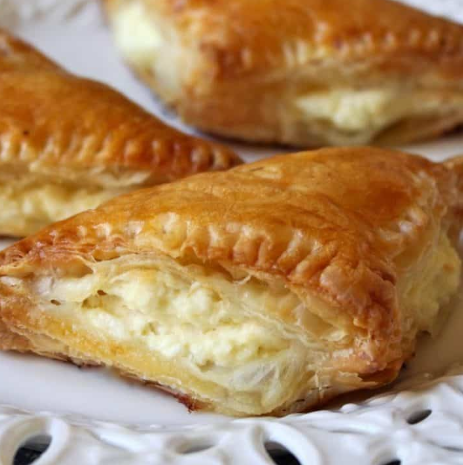 Tyropita - Layers of flaky phyllo dough filled with a rich feta cheese blend. (V)*