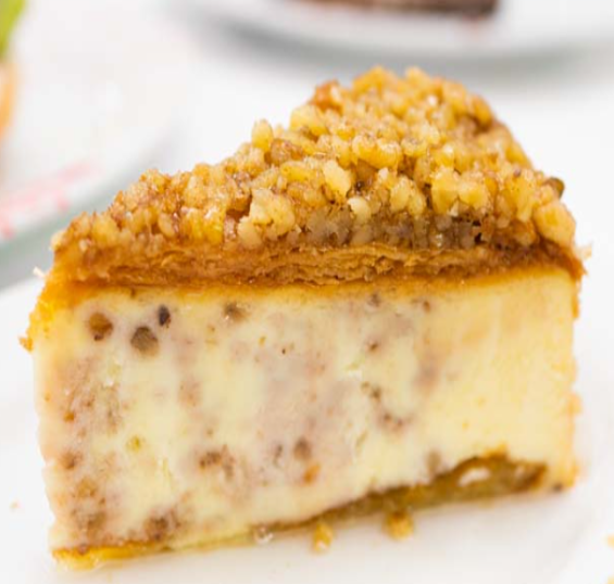 Baklava Cheesecake — Creamy cheesecake layered with crisp phyllo, nuts, and honey syrup for a rich Greek-inspired twist.