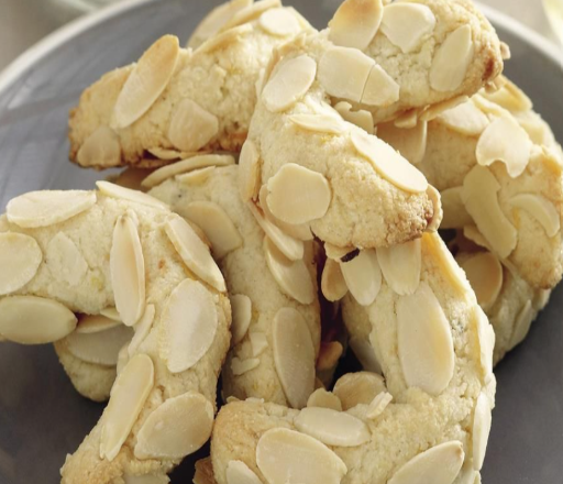 Amygdalota — Soft Greek almond cookies with a delicate sweetness topped with almonds and/or dipped in decadent chocolate