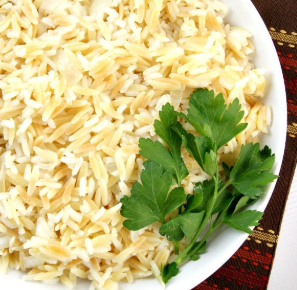 Pilafi - Fluffy rice cooked in a savory lemon chicken broth. (GF)