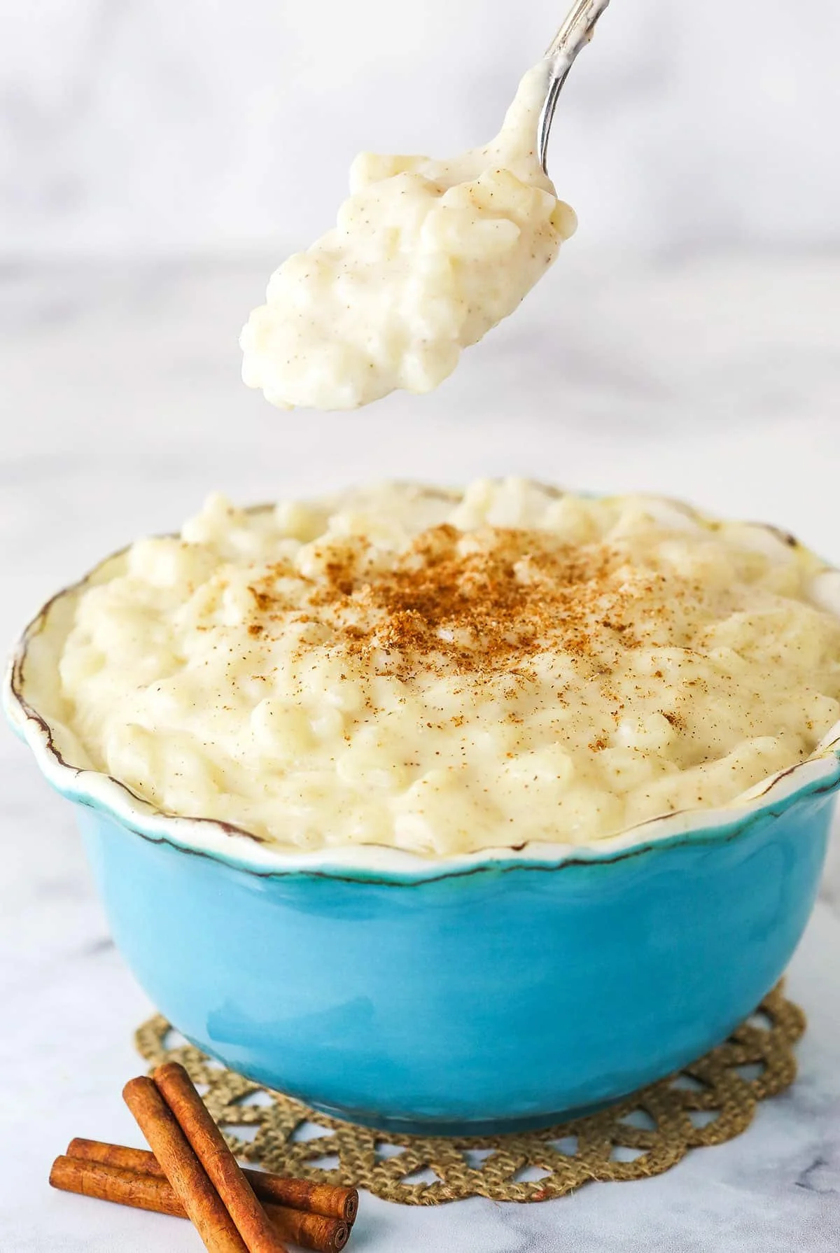 Rice Pudding — Creamy, slow-simmered rice in sweet milk, finished with a sprinkle of cinnamon.