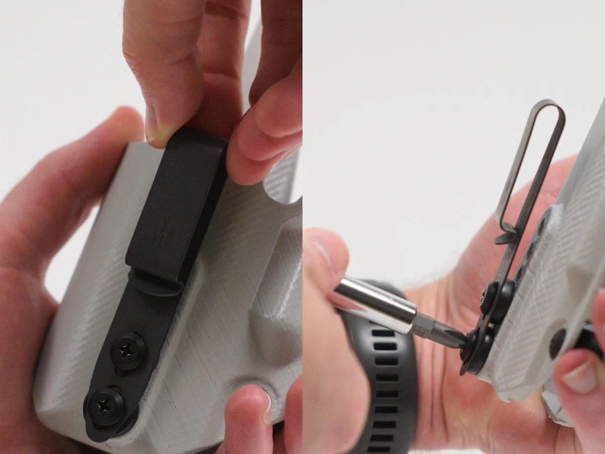 Close-up of hands adjusting the belt clip on a gray Mockingbird Defence holster using a screwdriver.