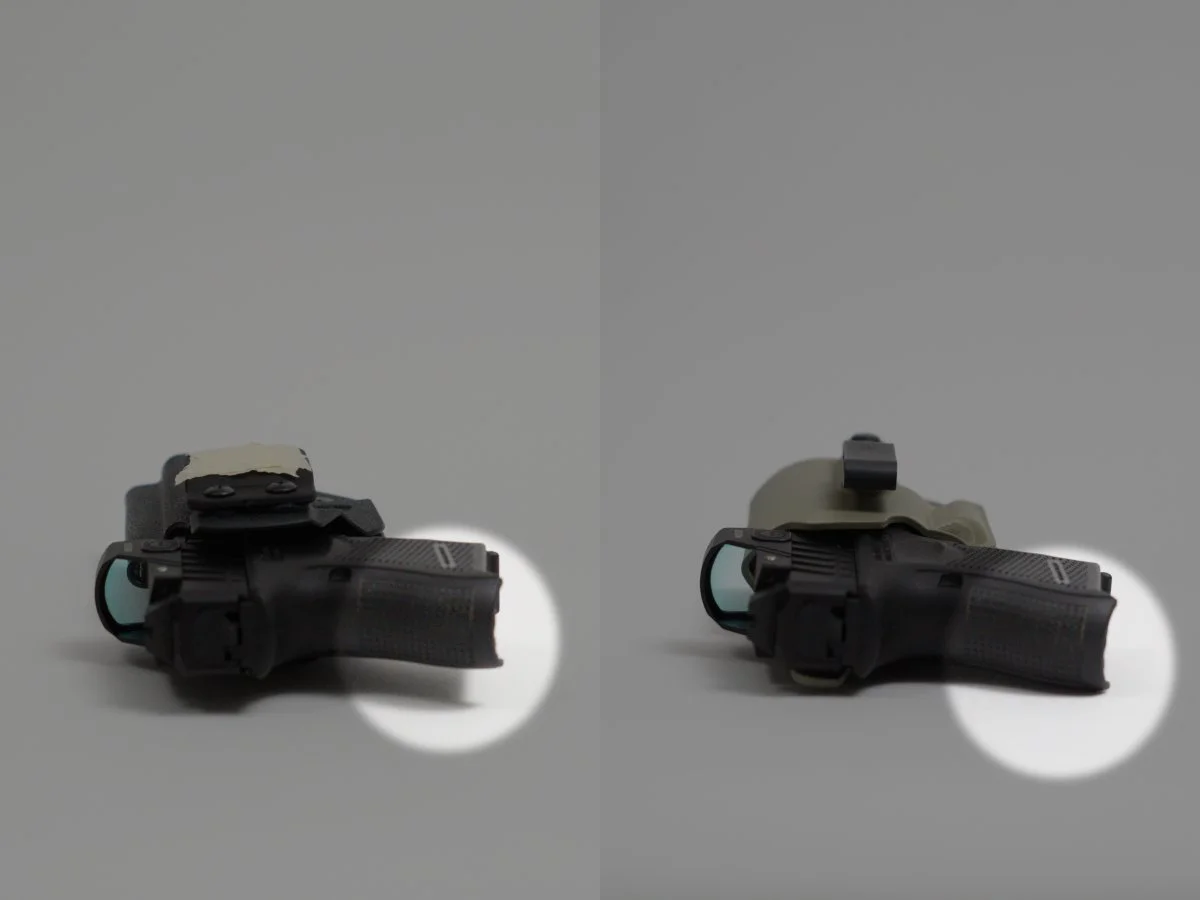 Two pistols in different holsters, the one on the right is in a foliage green Mockingbird Defence holster, viewed from the side on a gray background, spotlights pointing out the gap between the guns and the table caused by the holster design.