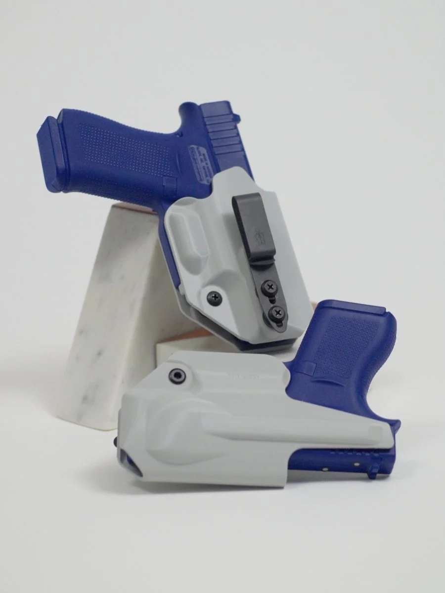 Two white / light grey holsters for Glock pistols, one above the other against a white background, showing the front and back of the same holster design.