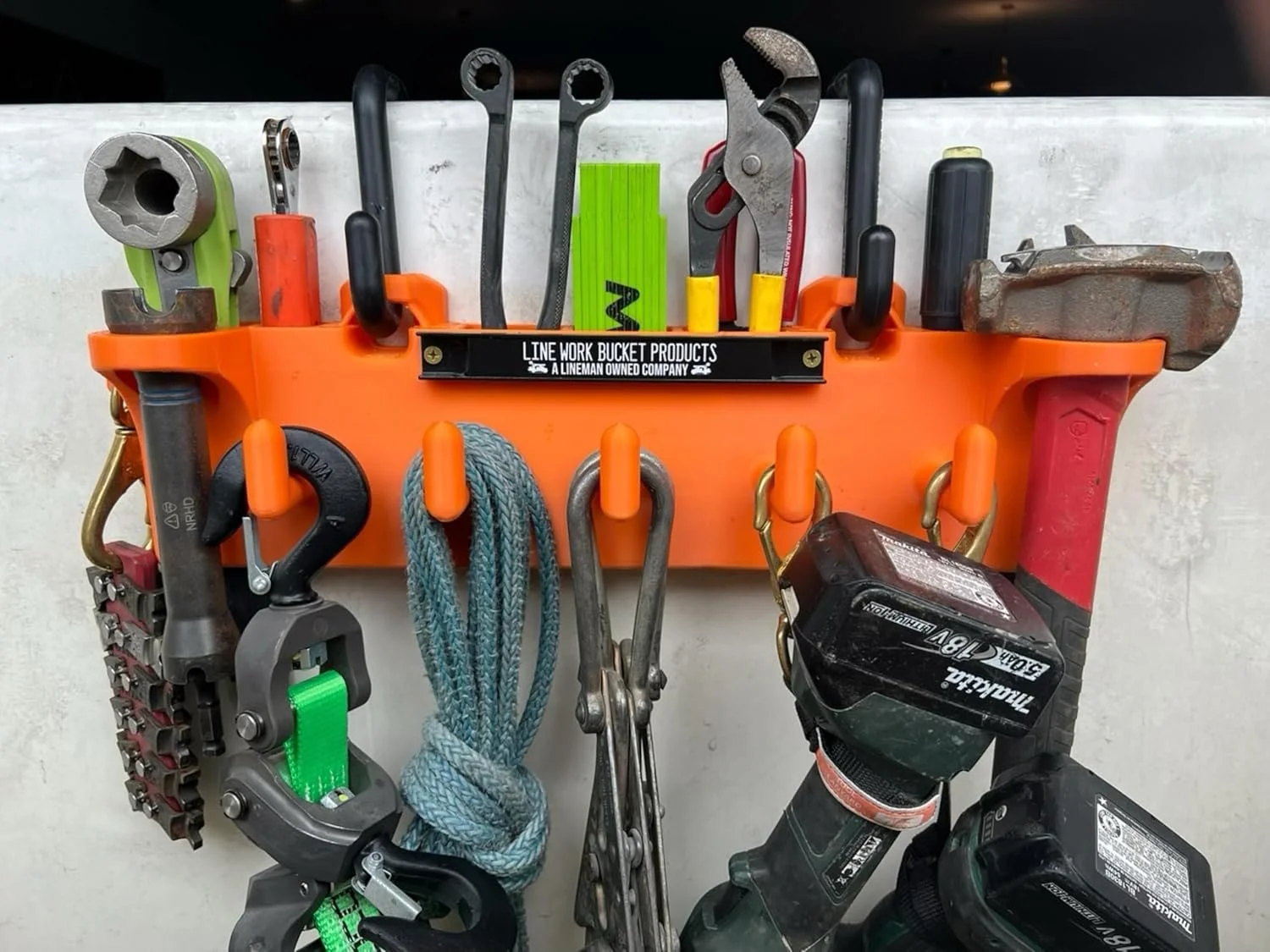 Big Rack Double D tool rack mounted inside a lineman bucket truck, organizing hand tools for easy access during aerial work.