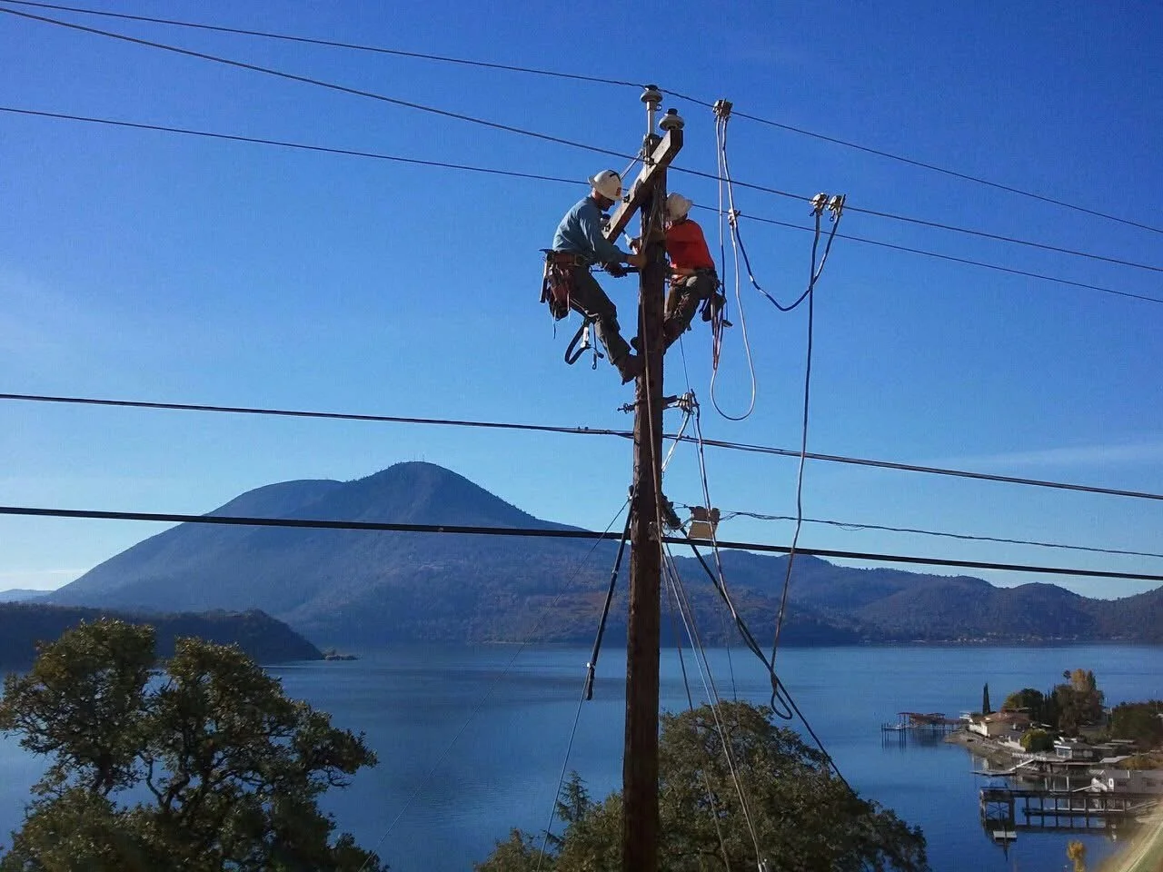 IBEW outside line workers on a power line