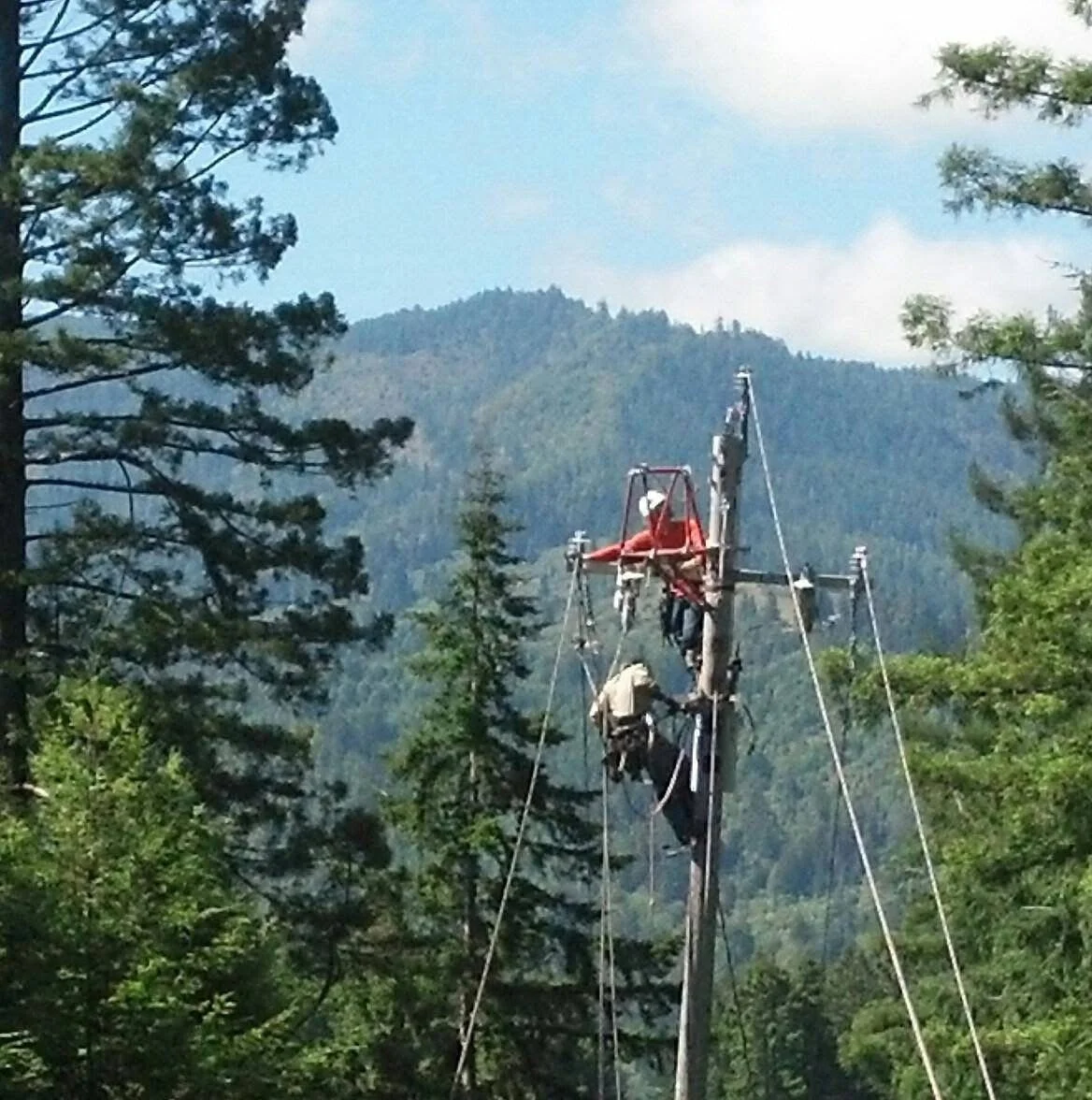IBEW outside line workers on a power line construction site