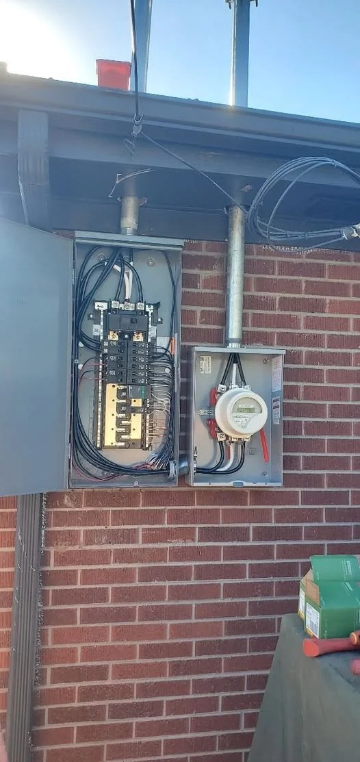 200-amp service upgrade for a Westminster ADU — A 200-amp service upgrade with a 150-amp subpanel for an accessory dwelling unit in Westminster. The photo shows the exterior panel, meter, and wiring during installation.