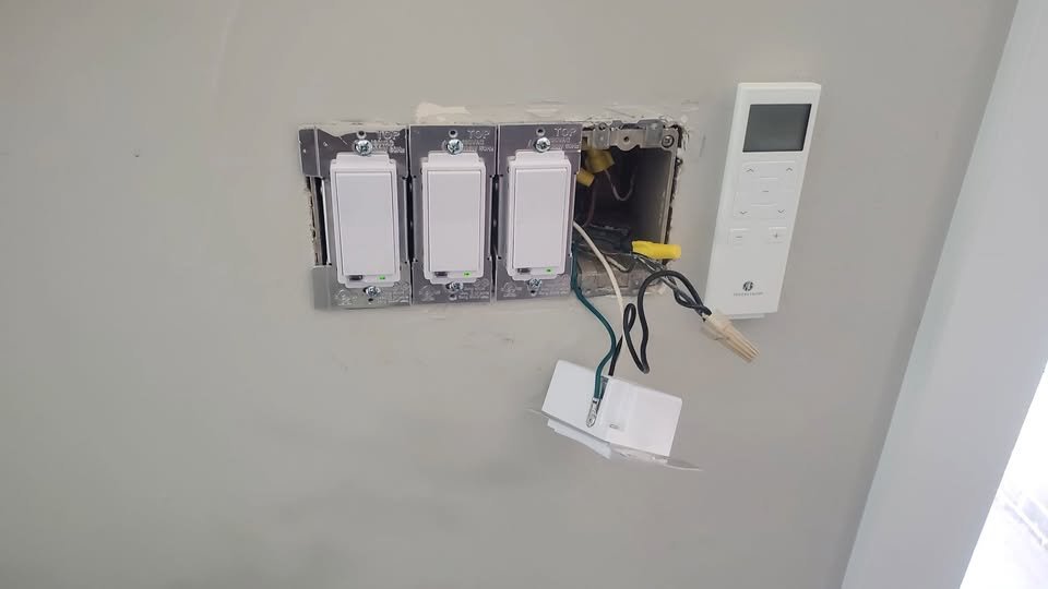Smart switch troubleshooting in Denver — Troubleshooting smart-switch issues during a Denver project. The photo shows the switches and wiring near the end of the work, before final finishing.
