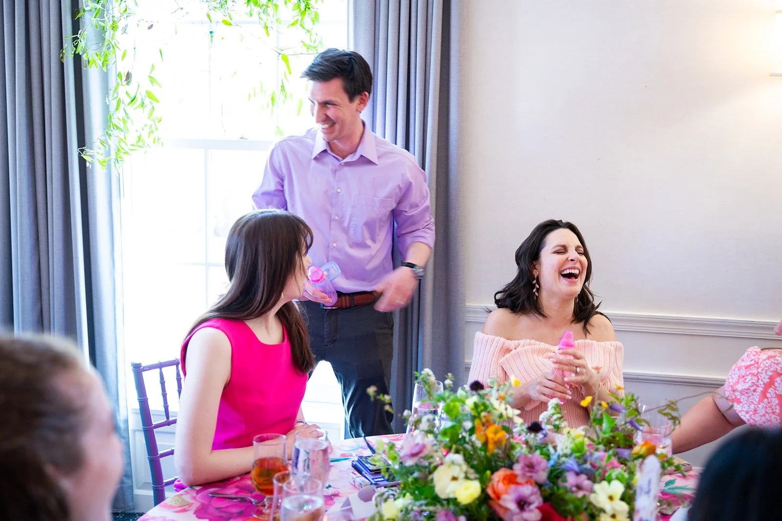Candid moment of laughter during event activities at Morrison House Old Town Alexandria