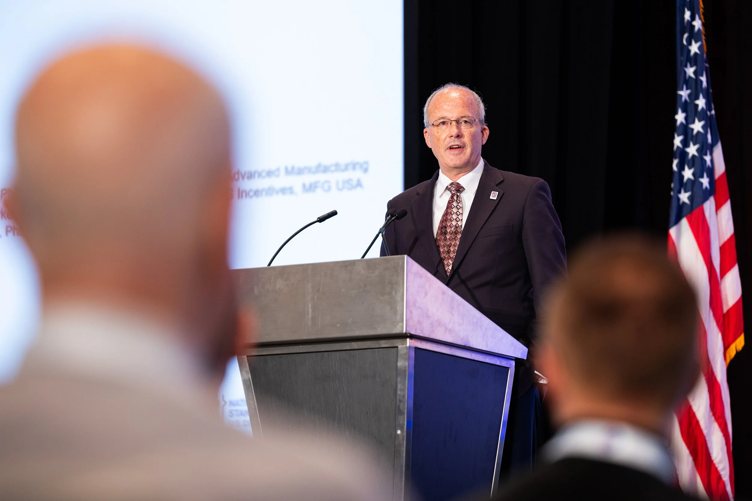 Keynote speaker presenting at policy forum and government conference event in Northern VA