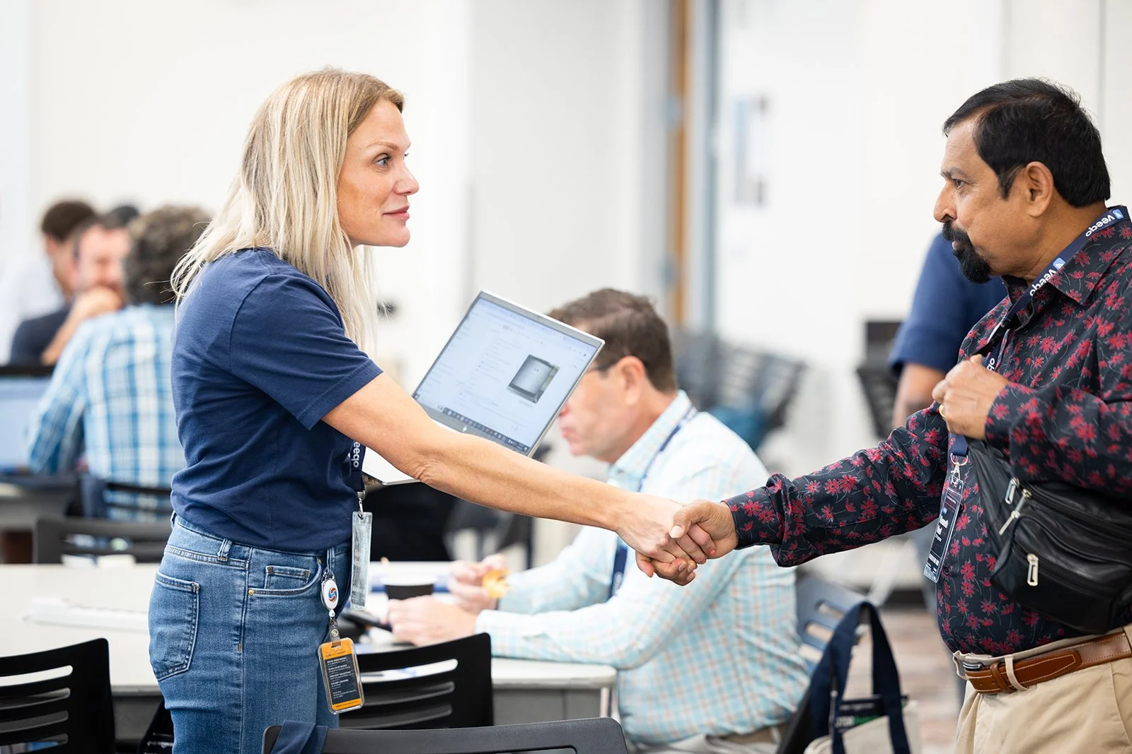 Attendees networking indoors during corporate event at AWS Jasper in Arlington Virginia