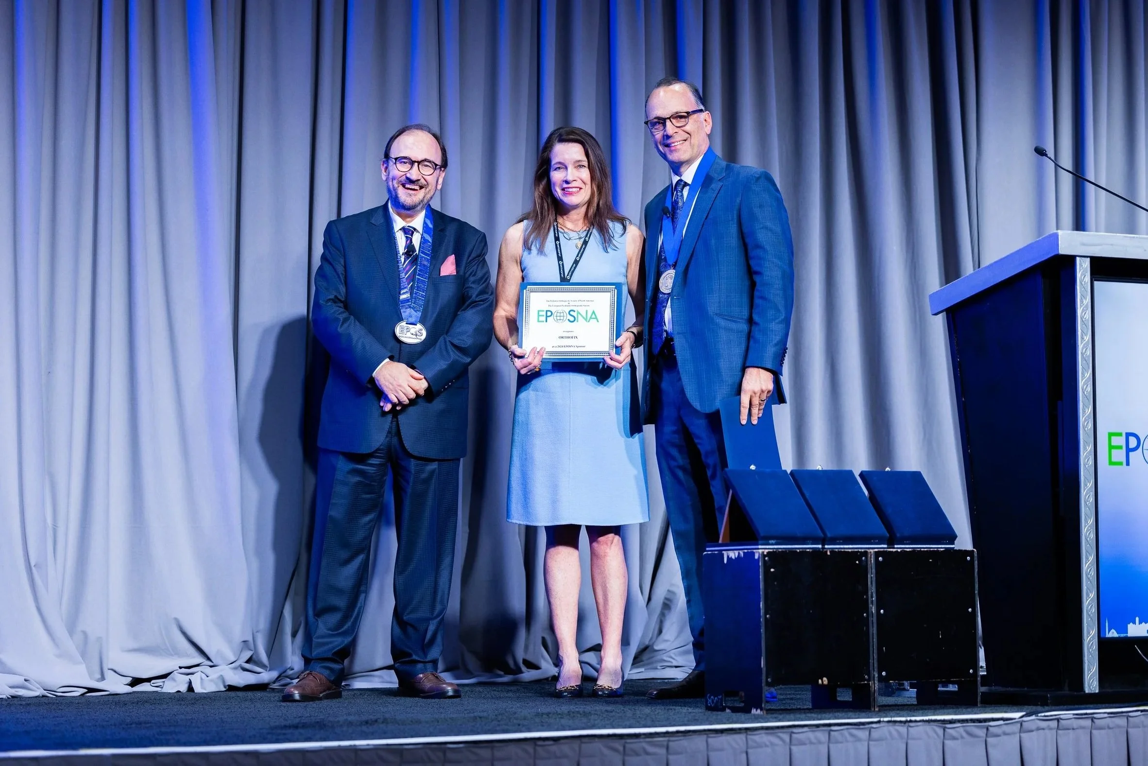 Industry association conference award presentation on stage during professional event - National Harbor, MD