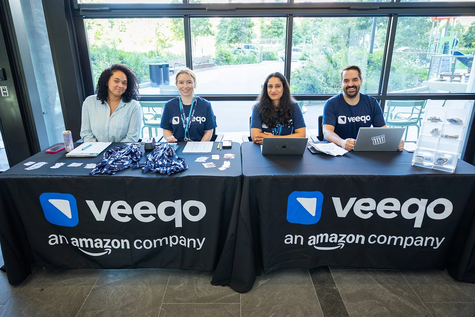 Veeqo corporate event registration table setup at AWS Jasper in Arlington VA with branded materials and staff