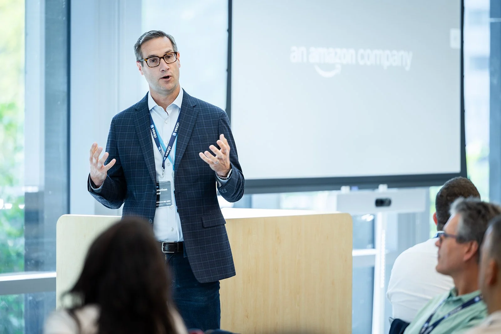 Corporate event speaker presenting to attendees during Veeqo event at AWS Jasper in Arlington VA