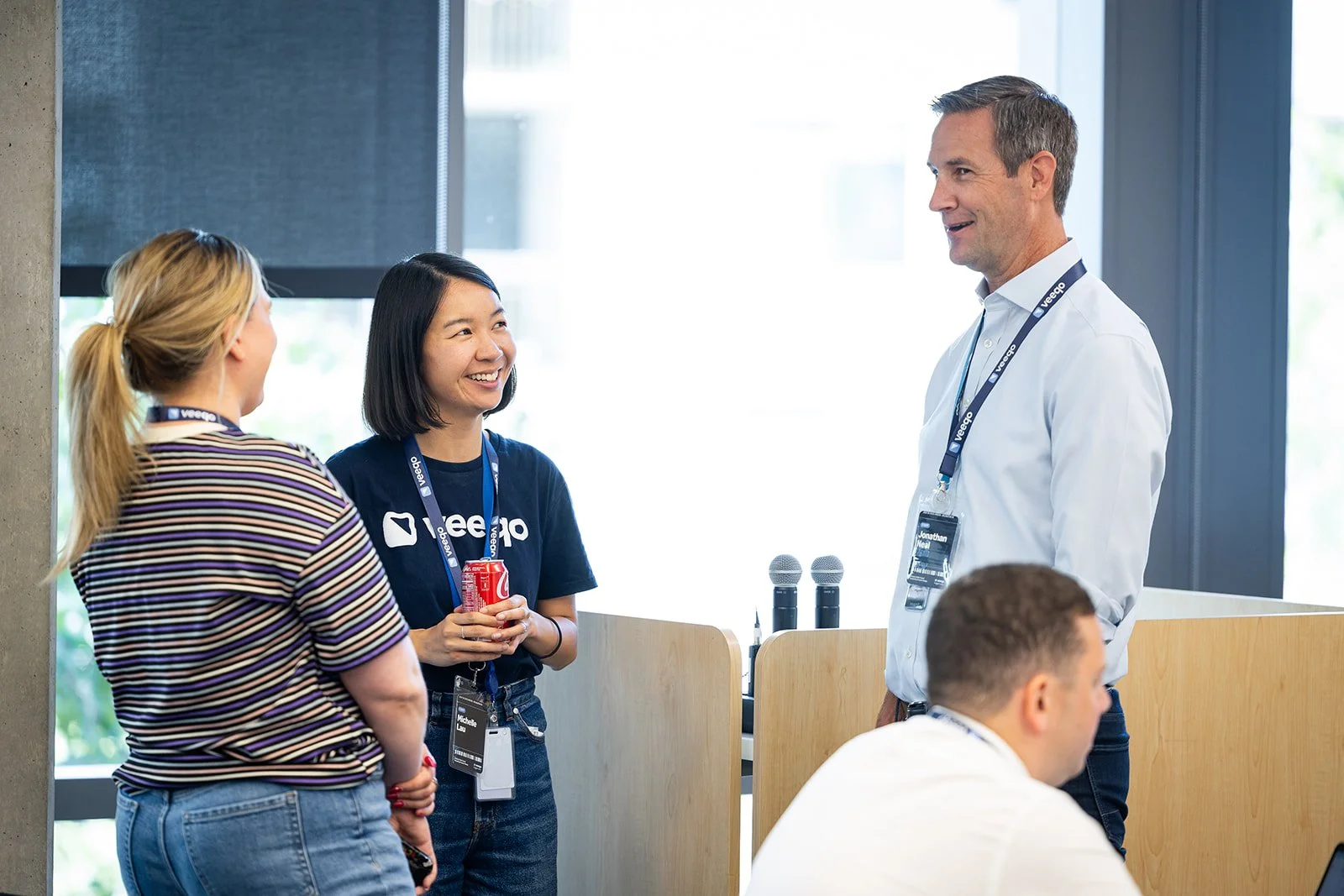Corporate event speaker engaging with attendees during Veeqo event at AWS Jasper in Arlington VA