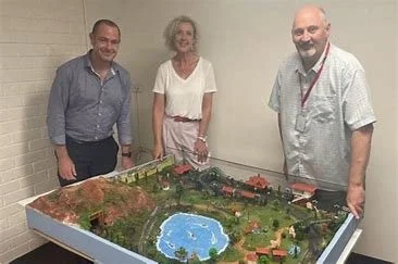 Our President showing off our diorama to the CEO of Gateway Services 