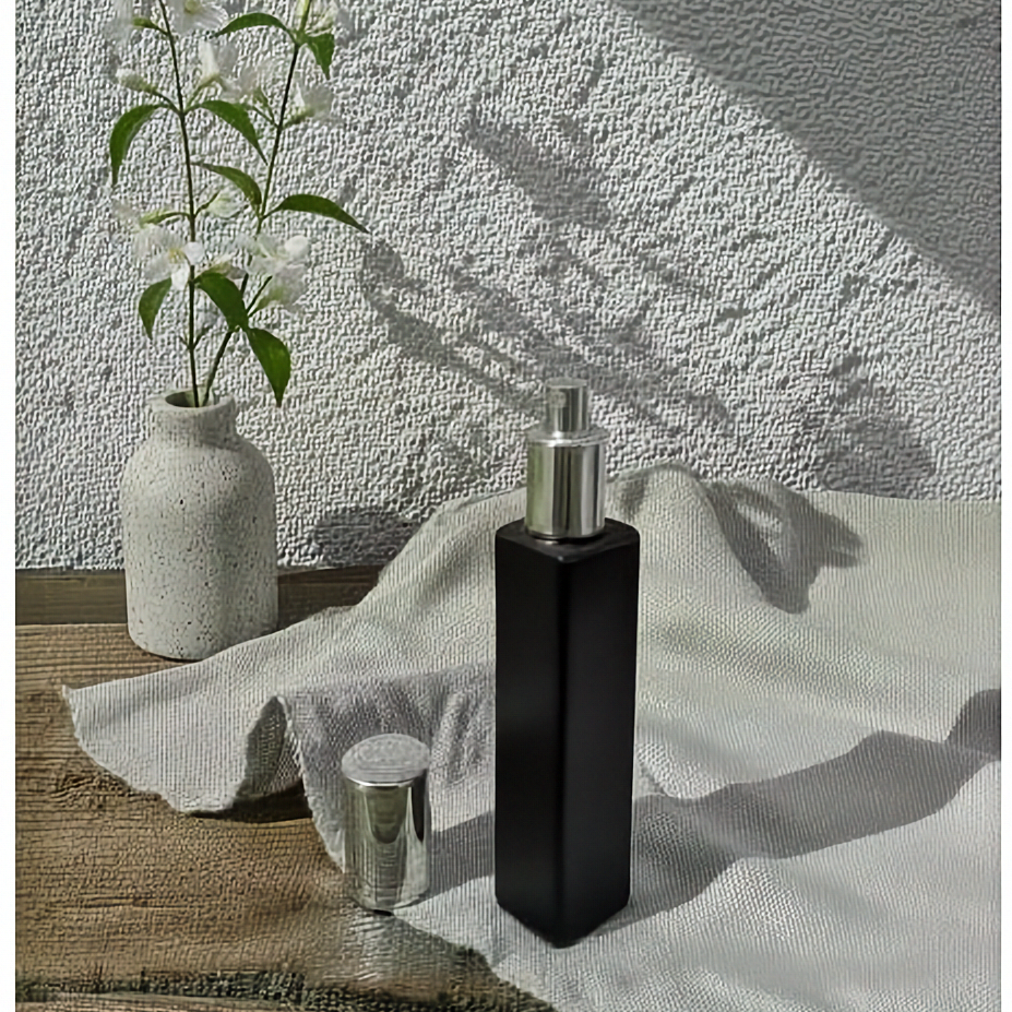 Luxurious room spray housed in an elegant black bottle with shiny silver cap for a touch of luxury.