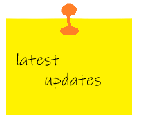 Yellow sticky note with the words 'latest updates' written on it, pinned with an orange pushpin.
