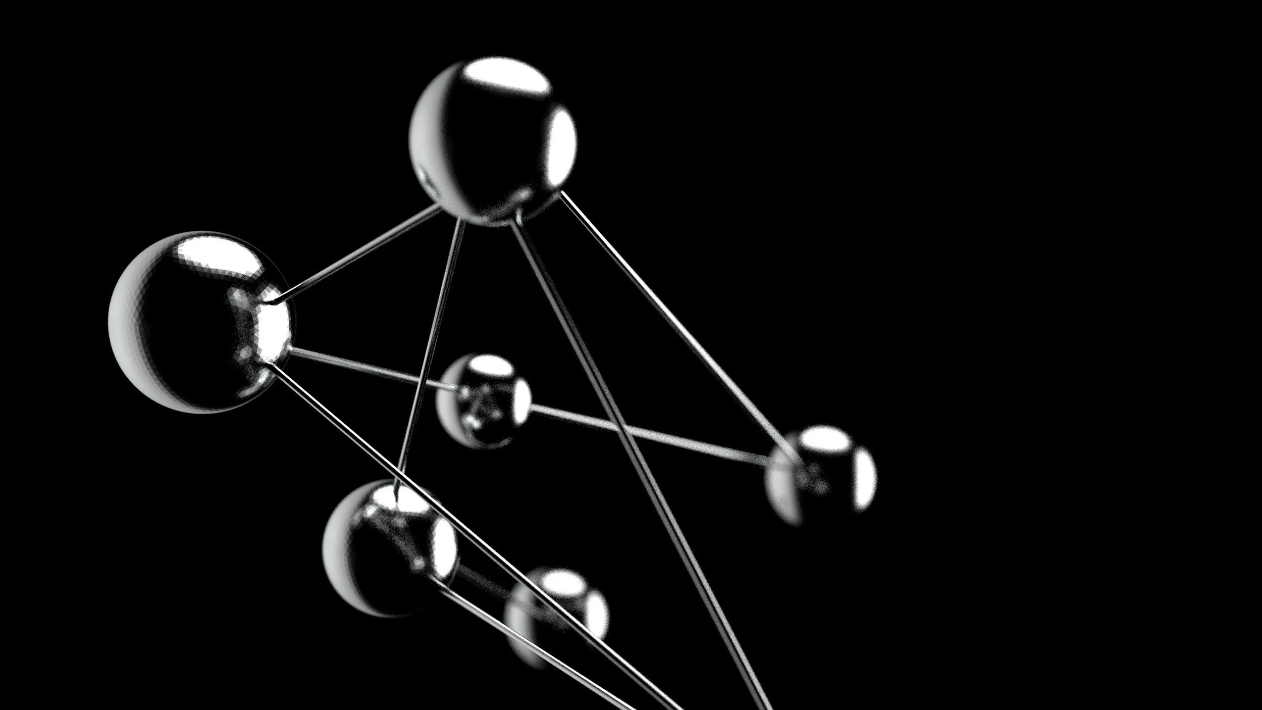 A black and white digital rendering of a molecular structure with interconnected spherical atoms on a black background.