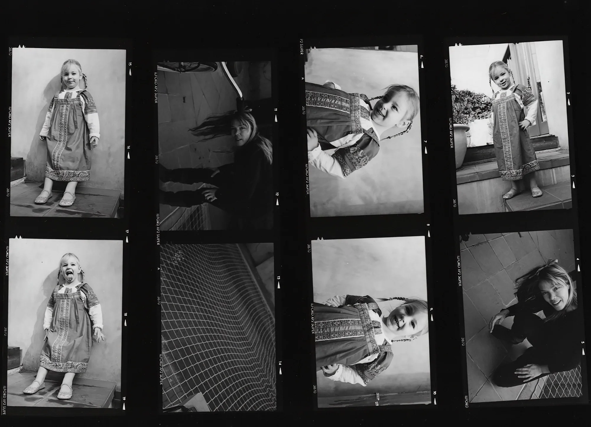Contact sheet (Ilford XP2): eight portrait frames of a five-year-old — the pictures still inside the box, waiting to be developed. Patricia von Ah, personal archive.