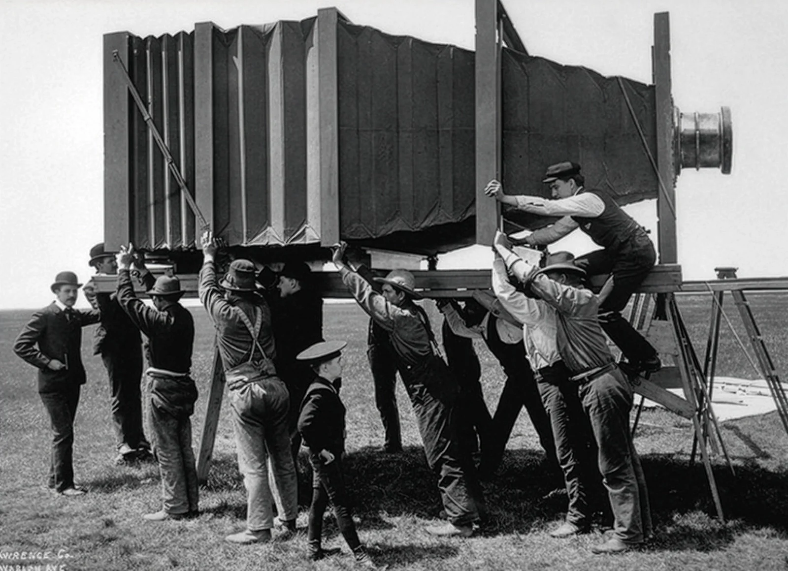 The Mammoth Camera, 1900: twelve men hold up a bellows camera the size of a small room to take a single photograph. George R. Lawrence Company, Library of Congress.
