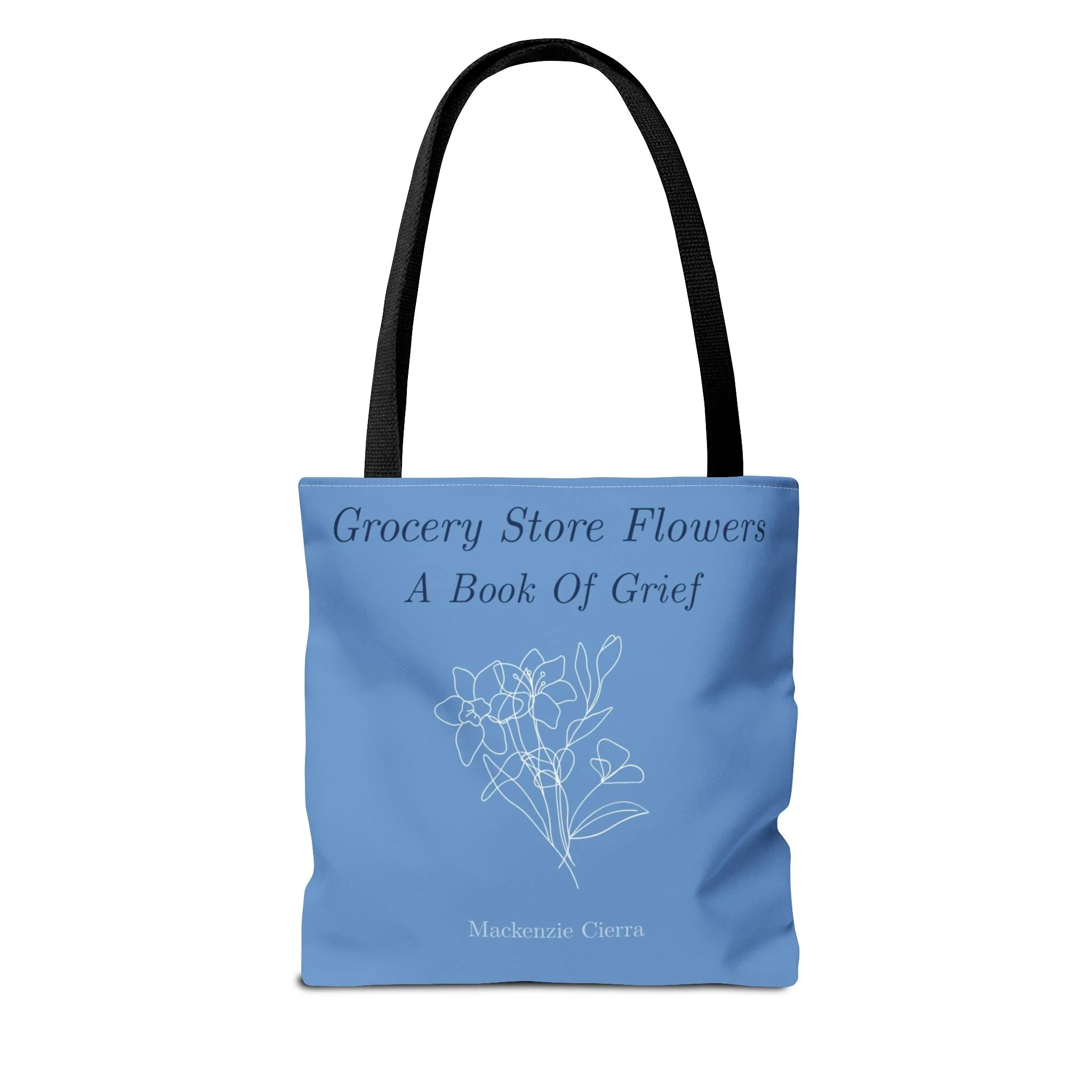 A blue bookmark with white text that says 'Grocery Store Flowers A Book of G' and a white floral illustration at the bottom.