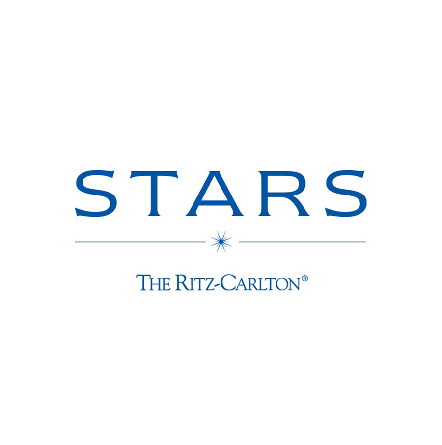 Logo for Stars at The Ritz-Carlton hotel, featuring the word 'STARS' in large blue letters and a small star icon beneath, with 'The Ritz-Carlton' written below.