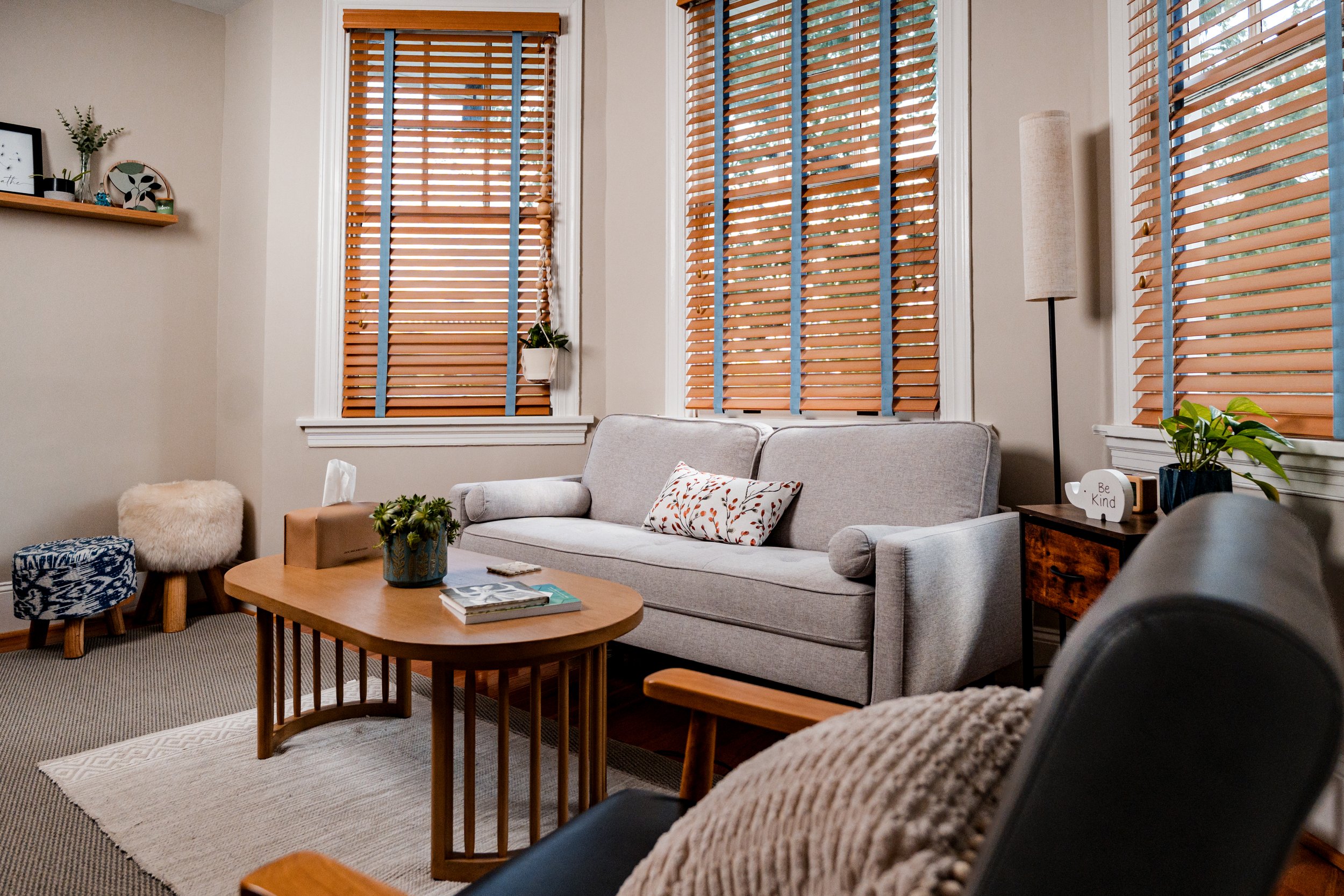 A grey couch in a therapy space.