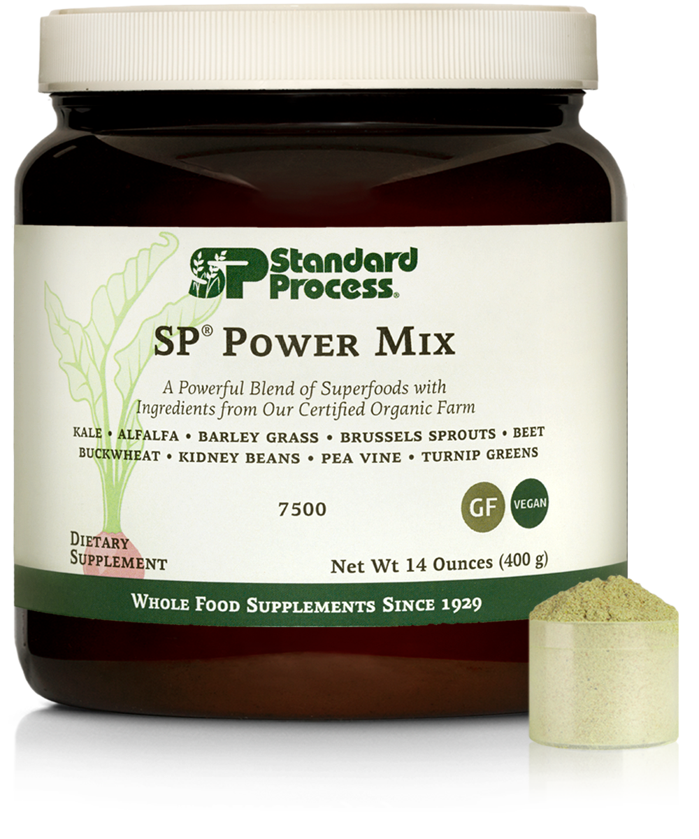 A container of Standard Process SP Power Mix dietary supplement, a blend of superfoods including kale, alfalfa, barley grass, Brussels sprouts, beet, buckwheat, kidney beans, pea vine, and turnip greens. The label indicates it is organic, vegan, gluten-free, and packaged in a 14-ounce jar.