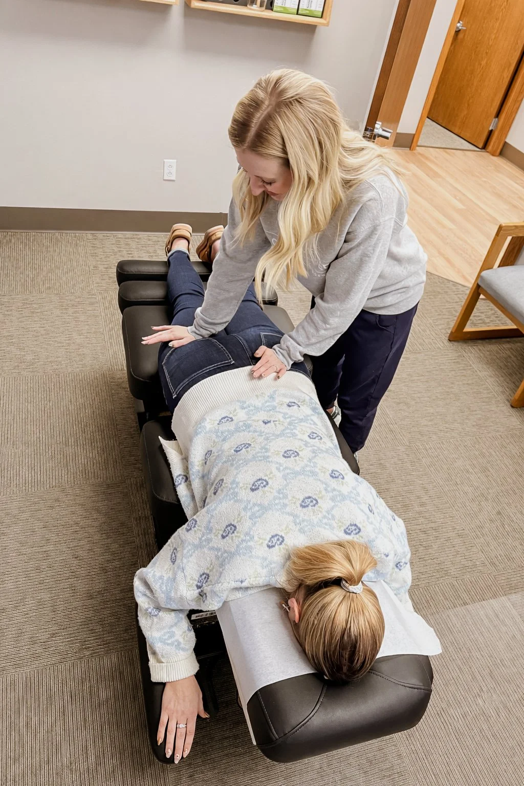 Gentle chiropractic adjustment to support pain relief, alignment, and whole-body healing in a calm, family-friendly office.