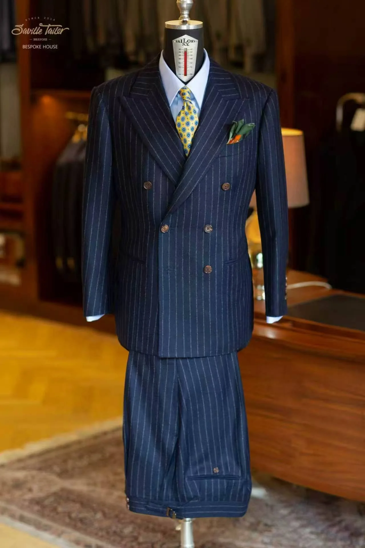 A bespoke dark blue stripe suit.