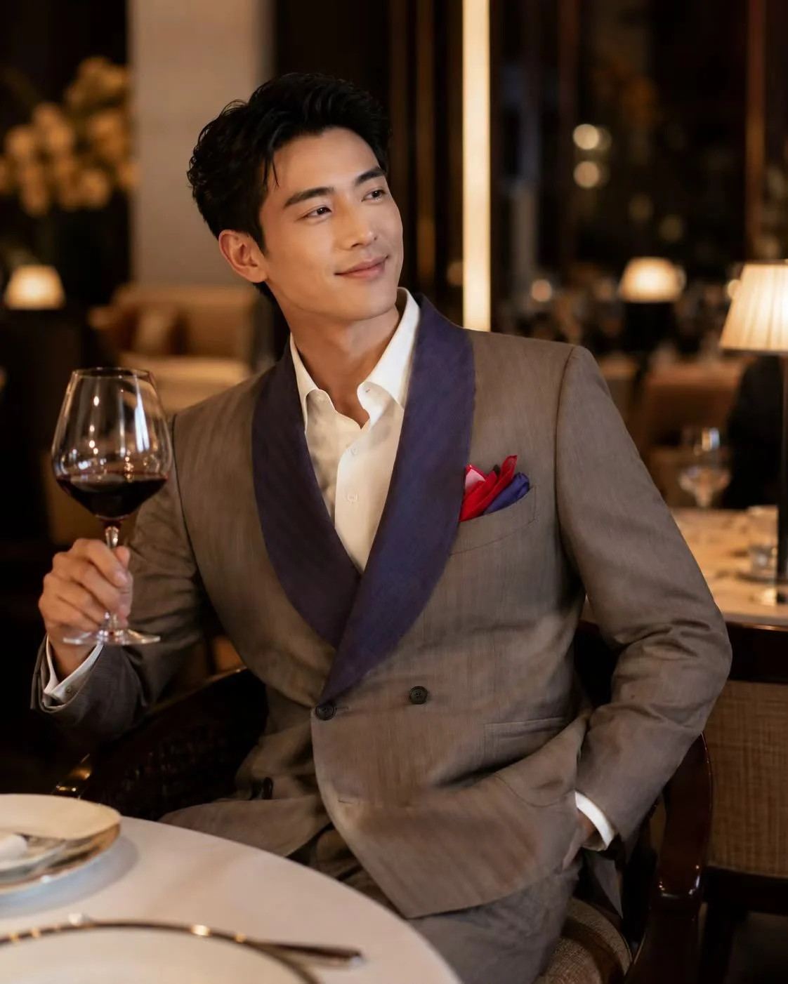 A bespoke suit worn by a male for a business celebration.