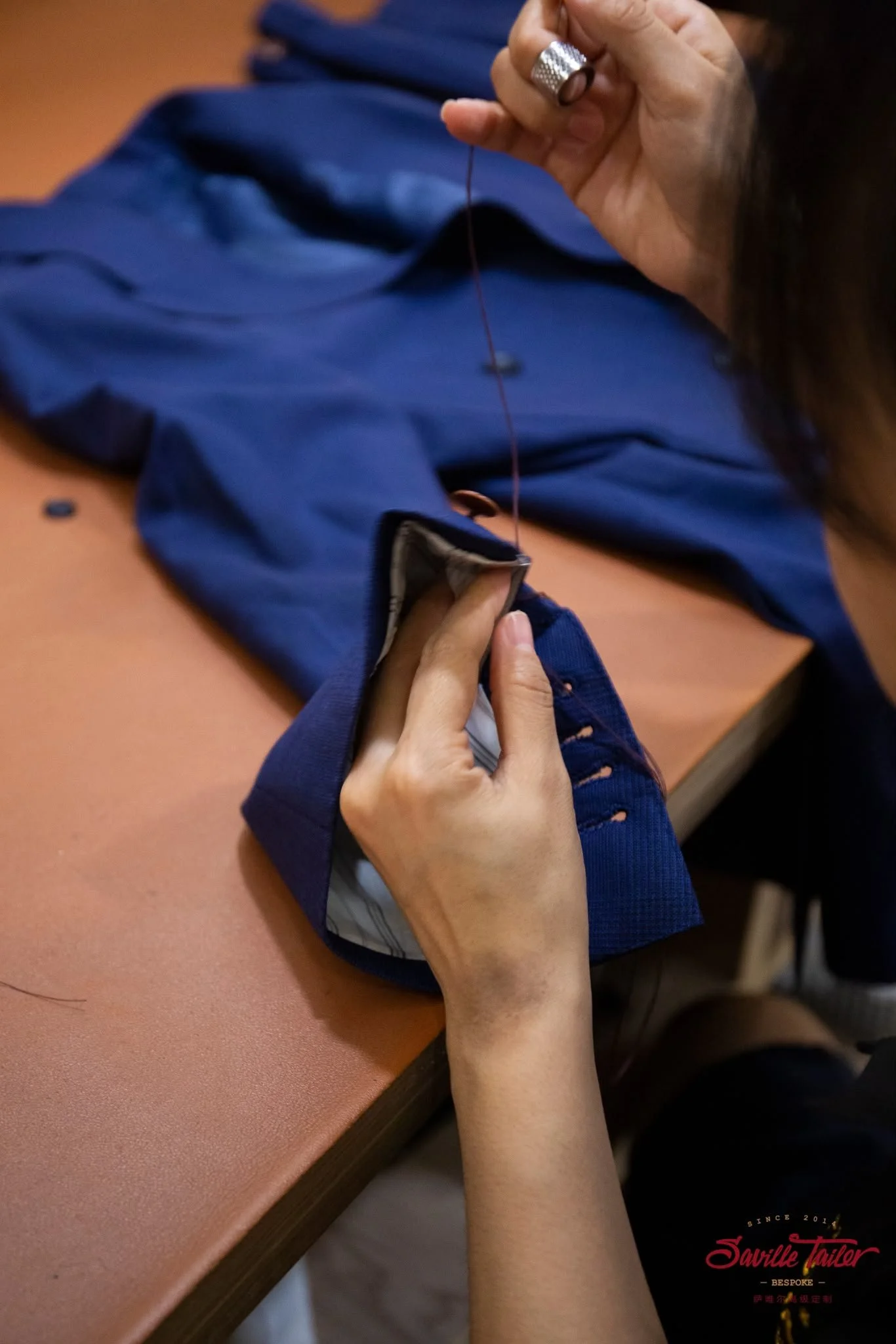 Bespoke suits are hand sewn.
