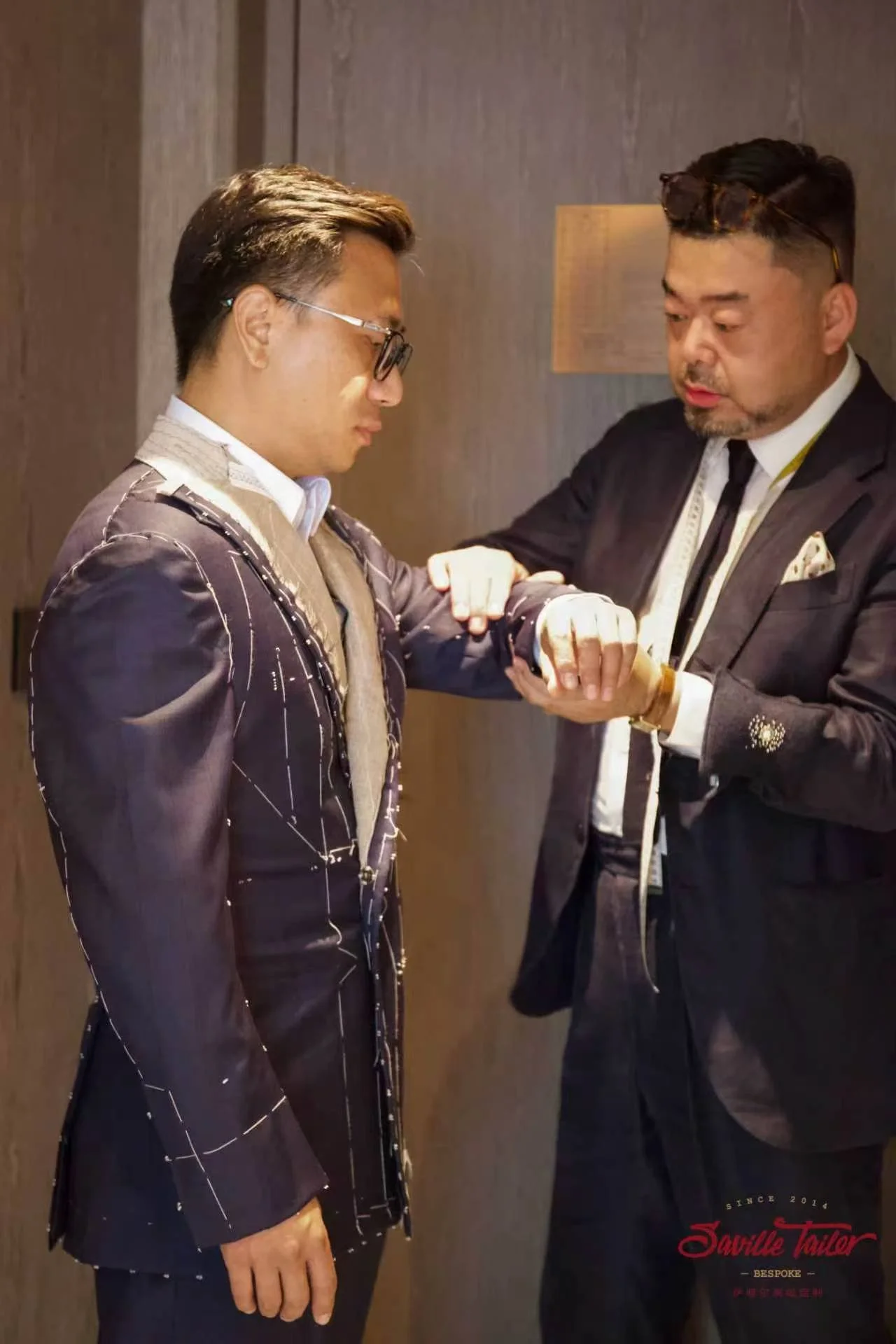 Fitting session for a bespoke suit.