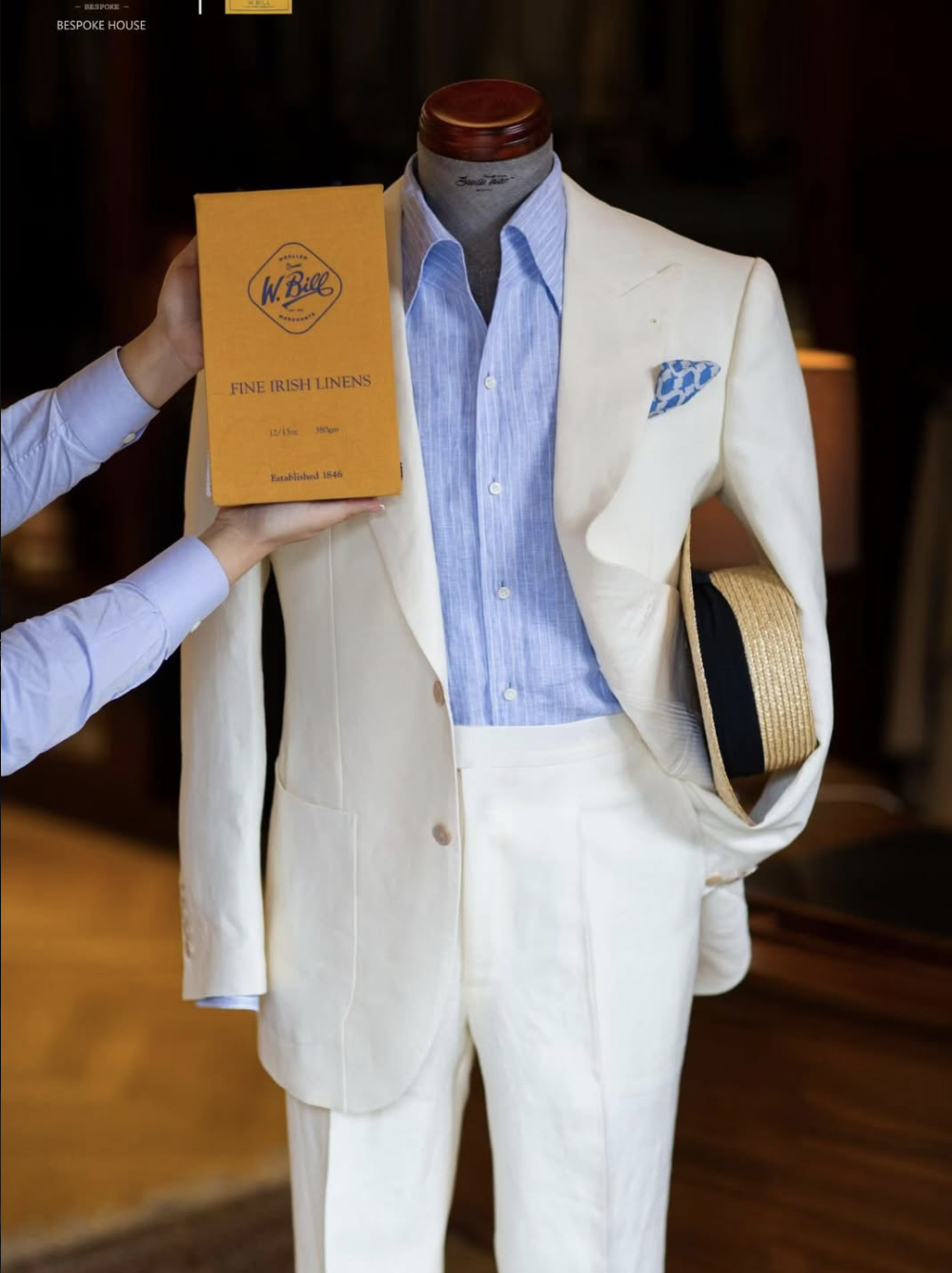 A bespoke cream suit.